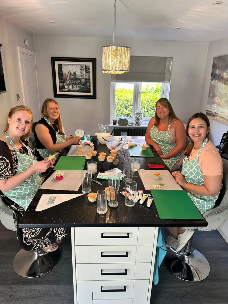 Emma teaching a buttercream flower piping class